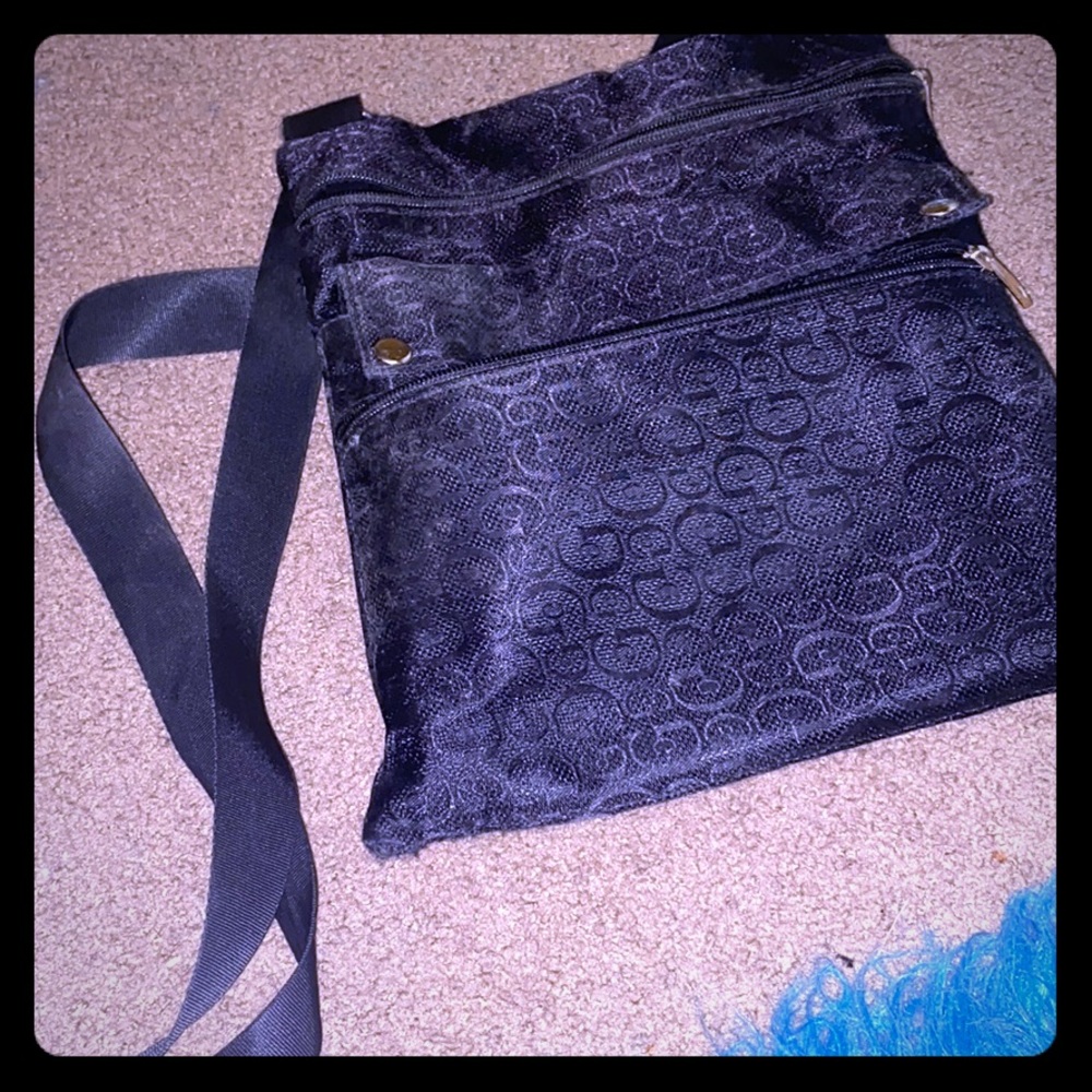 Black side bag gold zippers